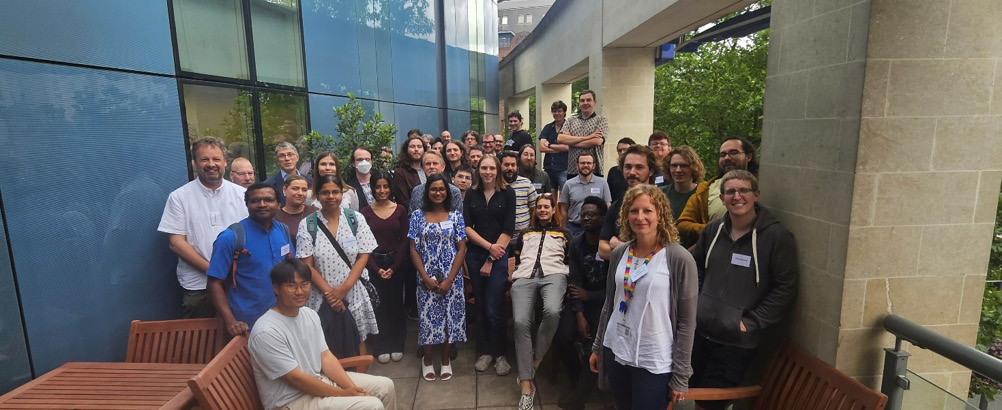 AI Conference 2026: Conference participants in a group photograph in front of a building